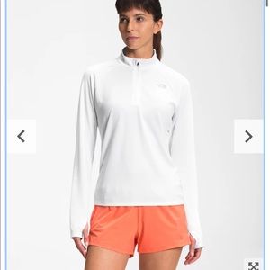 The North Face 1/4 zip up active wear top.